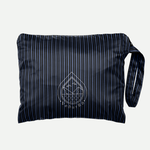 Blue VeðurRó rain poncho packed into its carrying pouch